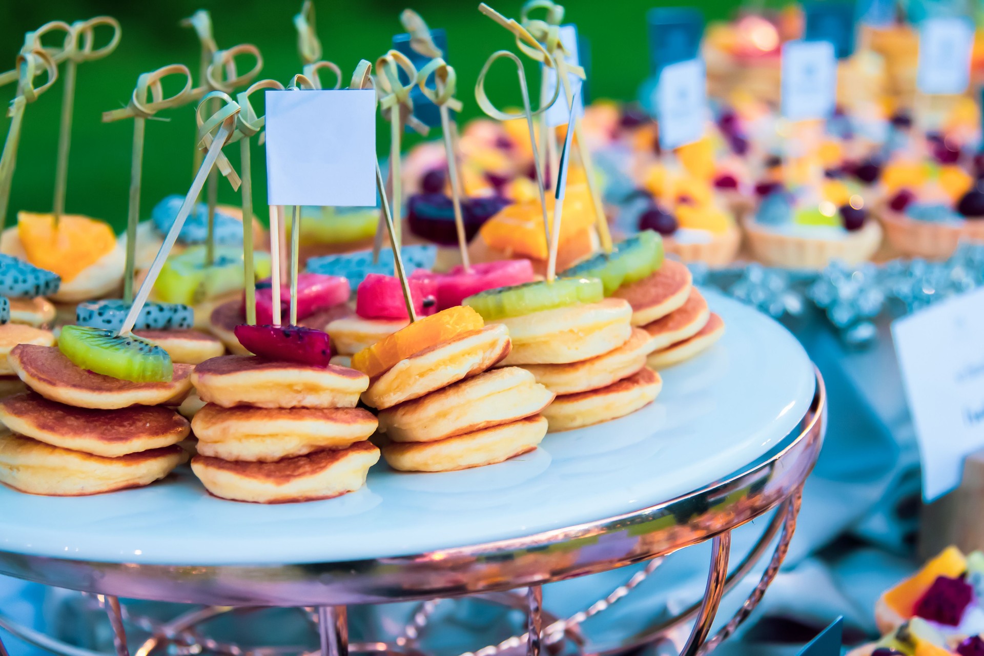 Dessert fruit pancakes at a wedding feast, food on a tray